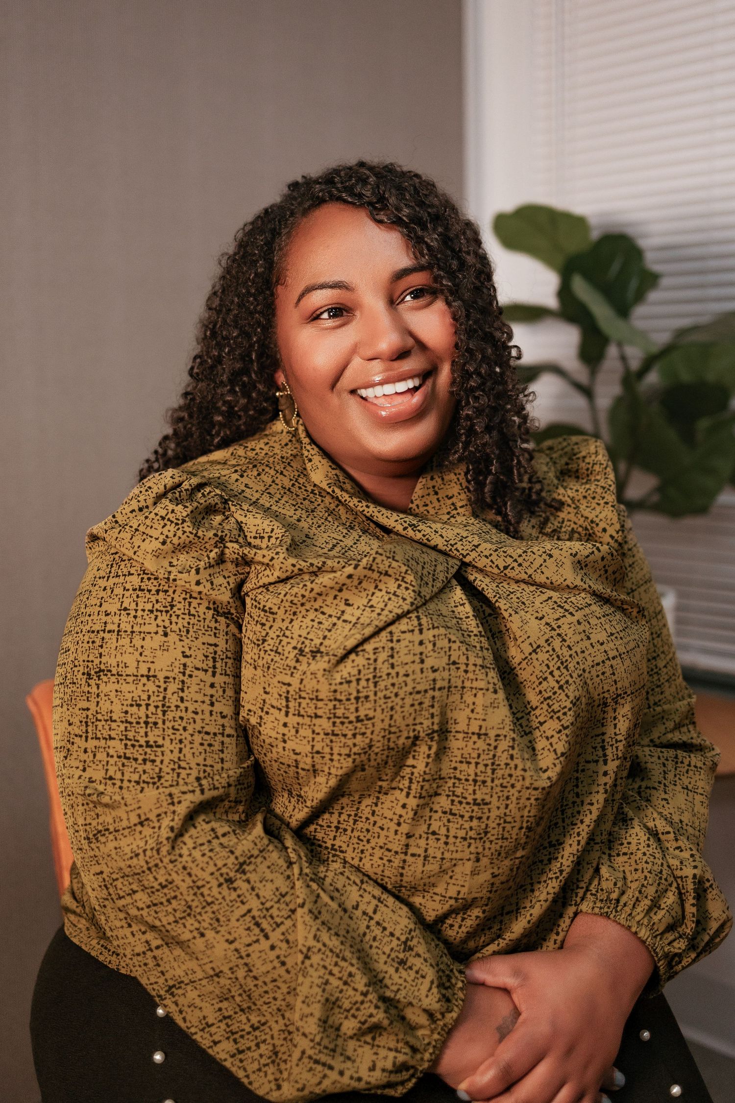 A series of photos showing a person wearing a textured olive green sweater with dramatic puff sleeves in different poses.