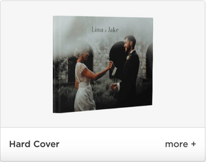 A white hardcover wedding photo album with sample image displayed on the cover against a light background.