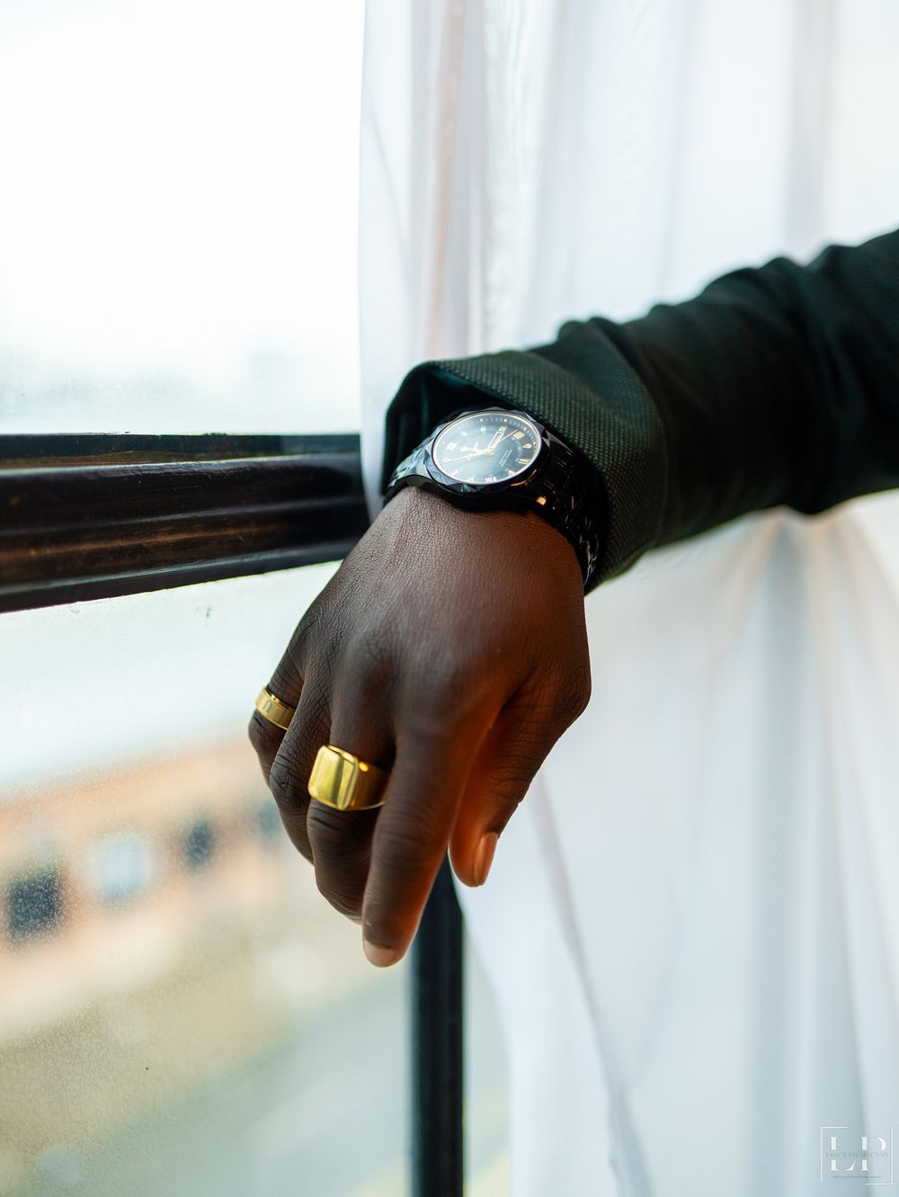 Close-up detail shots of hands wearing rings against a bright window background.