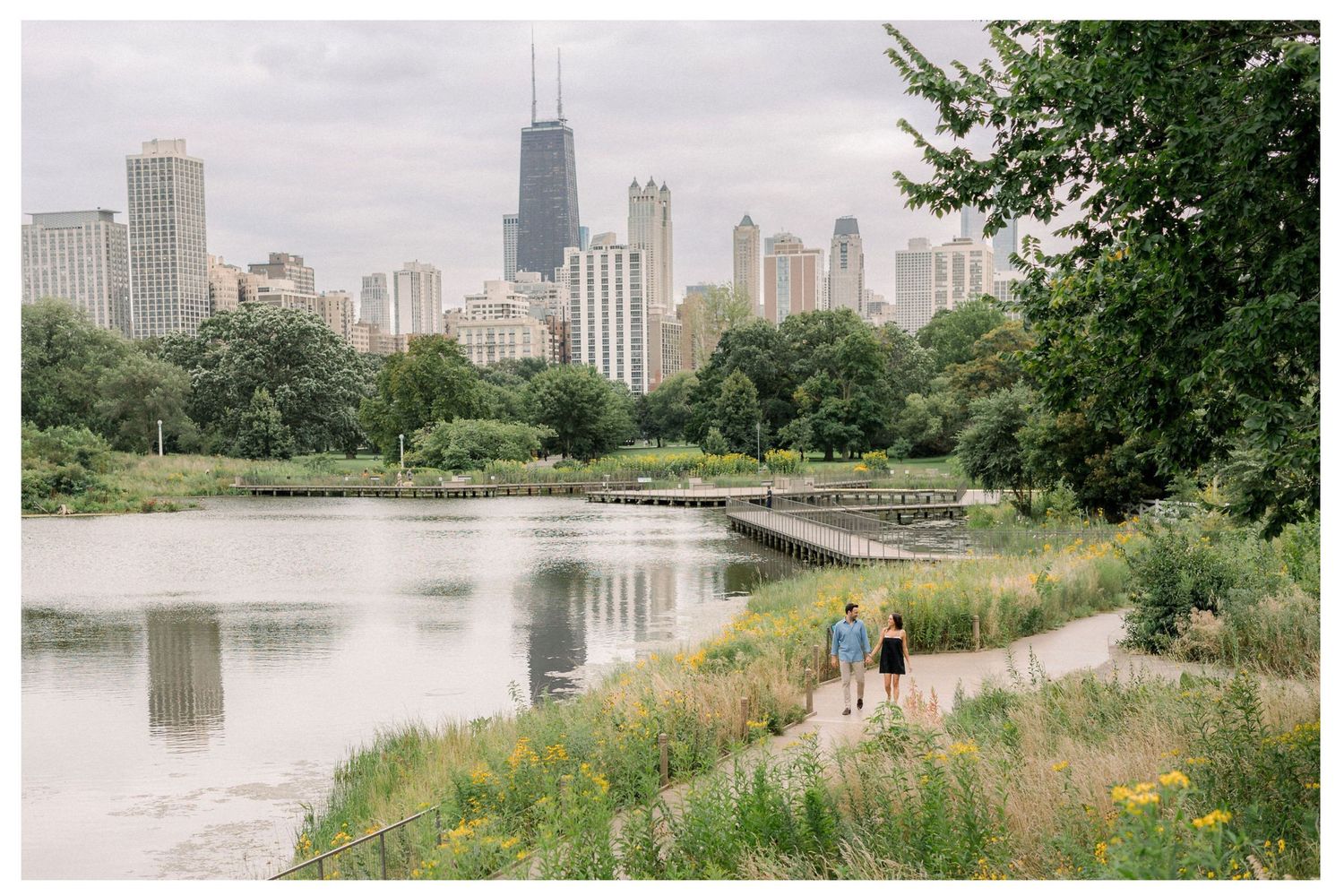 Romantic Lincoln Park boardwalk proposal surrounded by greenery in Chicago.