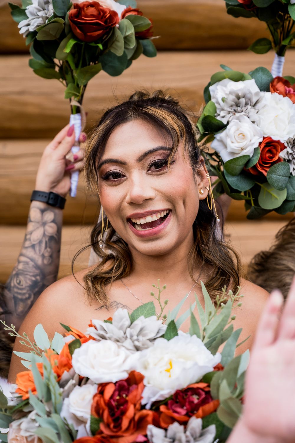 Beautiful wedding bouquets with red and white flowers, eucalyptus greenery and delicate floral arrangements.
