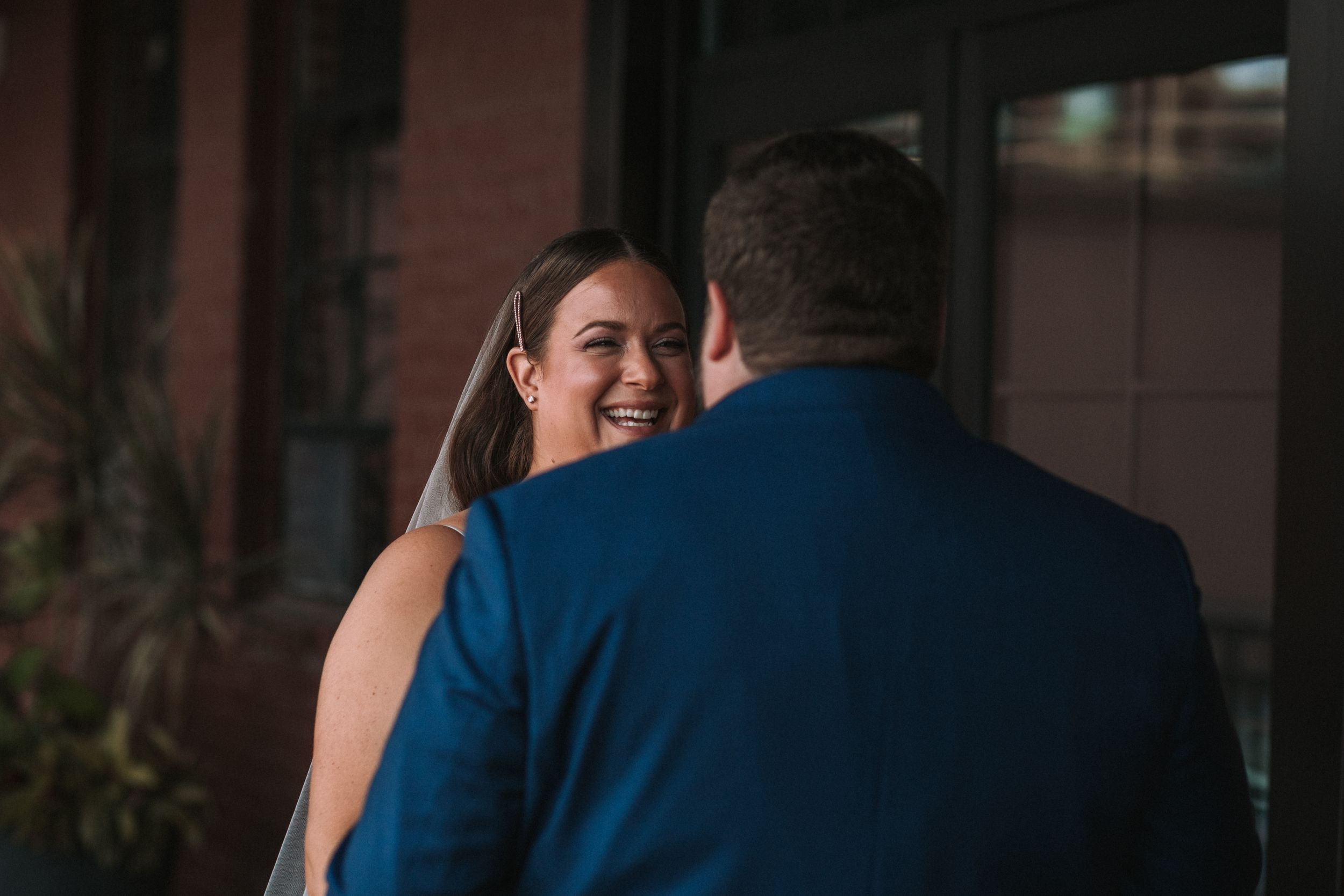 A sequence of six photos showing a couple embracing and dancing together in a dimly lit indoor setting.