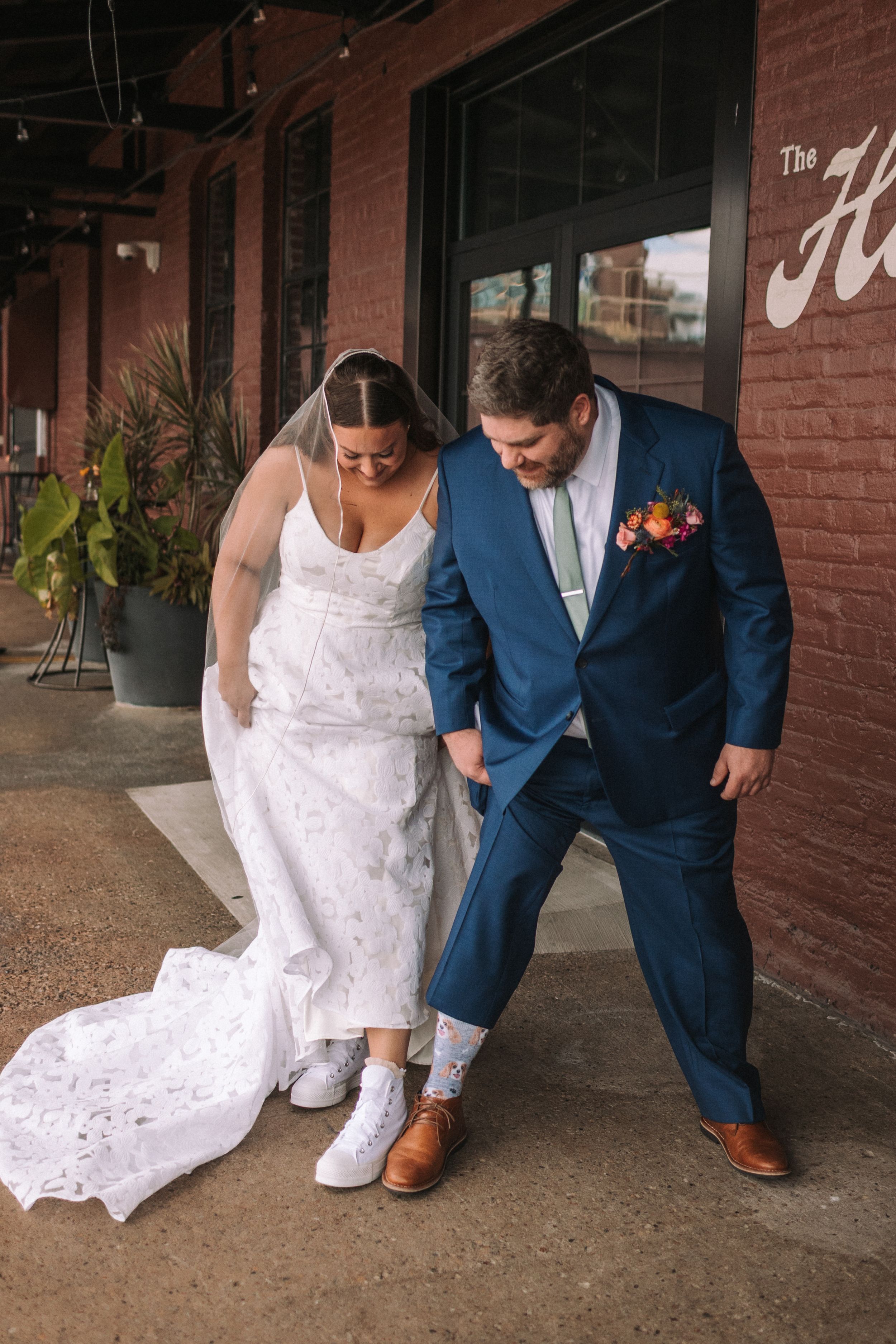 A series of wedding photos showing a couple's shoes and dress details against a brick wall background.