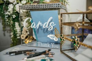 Blue and gold thank you cards display with decorative butterfly accents.