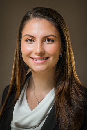 Professional woman in black blazer and white top shown in series of business headshots.