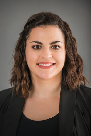 Professional studio portraits showing confident expressions while wearing a black blazer.