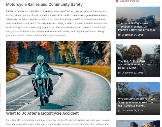 Motorcyclist riding on a winding mountain road with safety gear and teal motorcycle in scenic setting.