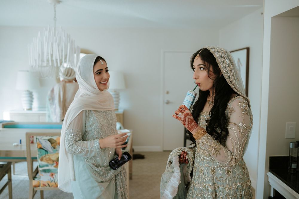 A sequence of photos showing a woman in white hijab and dress getting ready in a bright room.