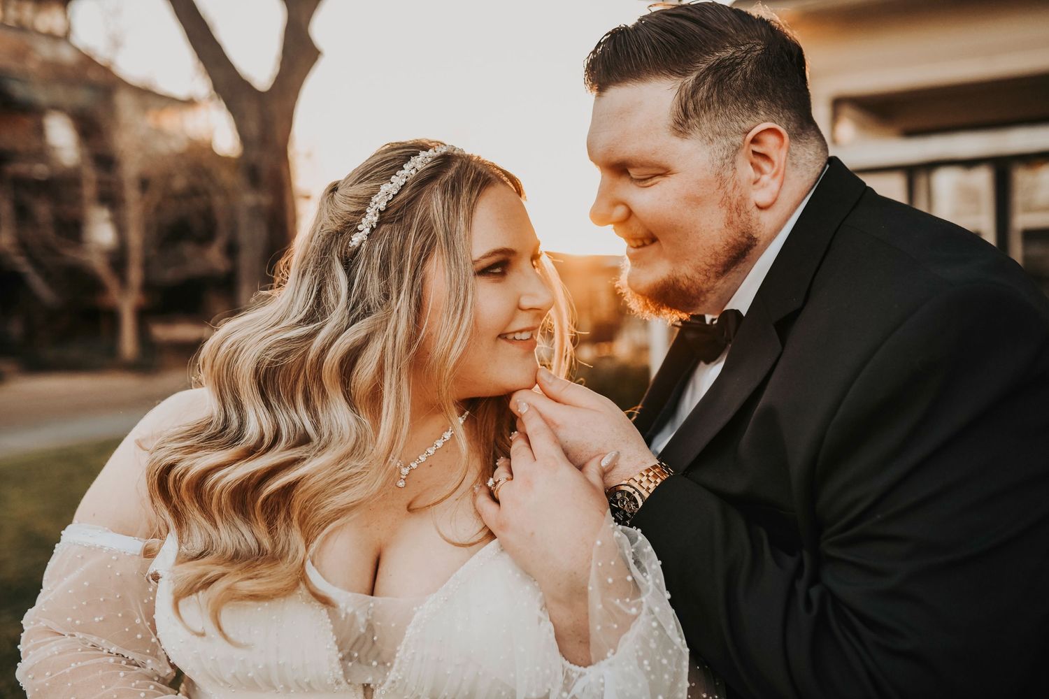 Bride and groom kissing at sunset during golden hour wedding portraits in Dallas–Fort Worth