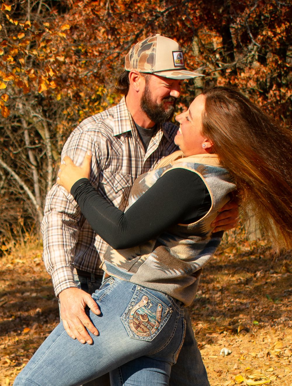 Girlfriend and Boyfriend coming up from a dip kiss laughing and having fun.