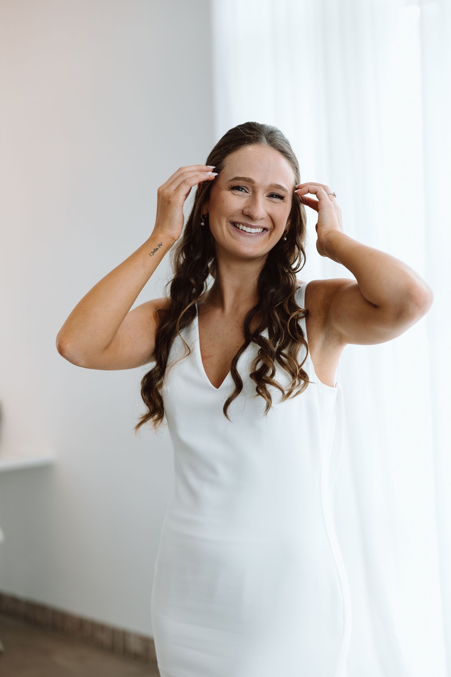 Joyful moment captured in a bright room with white decor.