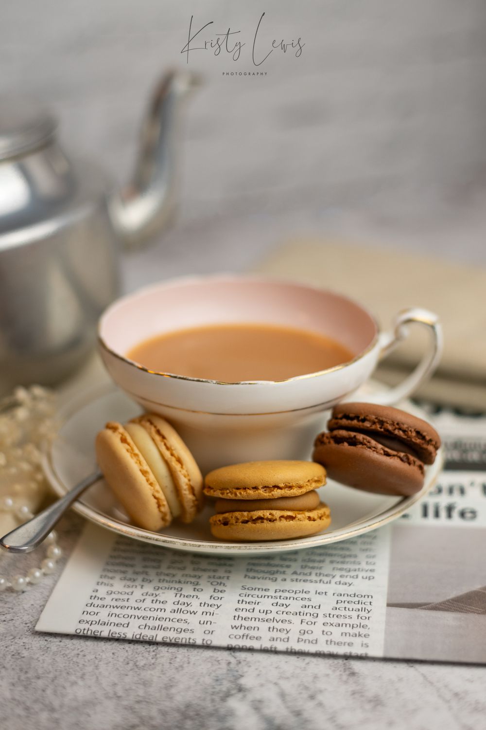 Close-up product photography of a vintage teacup and macarons, shot in Blackwood, South Wales