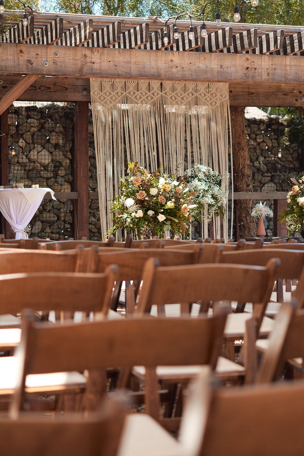 Decorated ceremony area at the Riverbed Farm in Anaheim, California taken from the guest seating area.