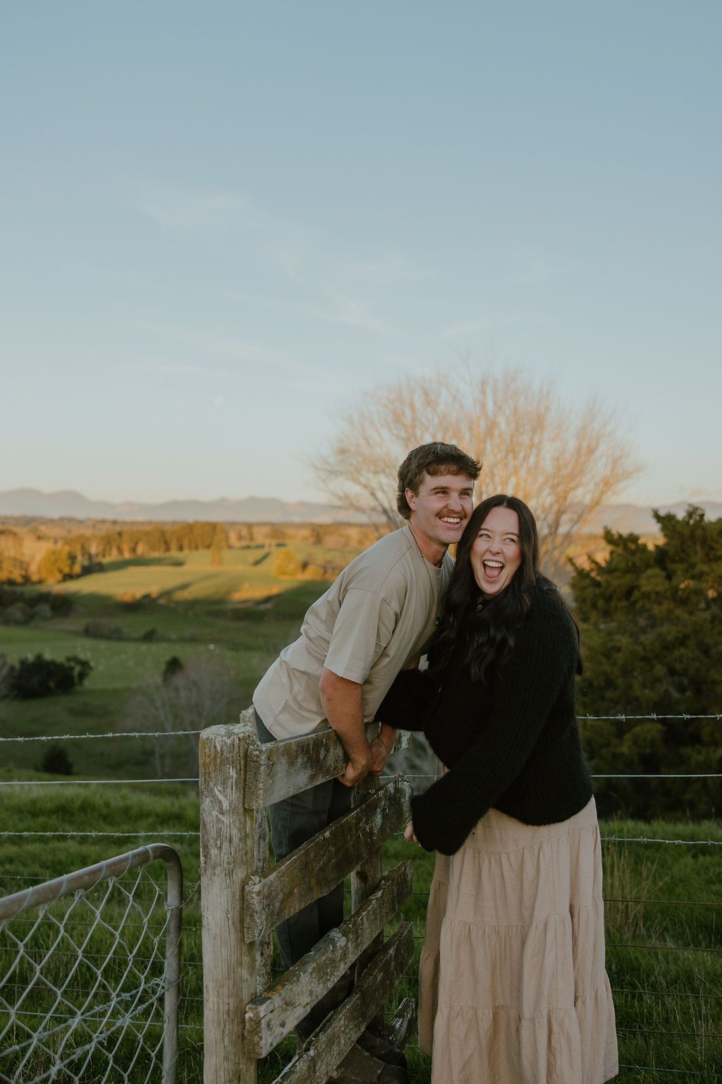 Fun laidback sunset engagement photos on farm in Moutere Valley, Nelson Tasman. Howdy Pictures are film wedding photographers in New Zealand