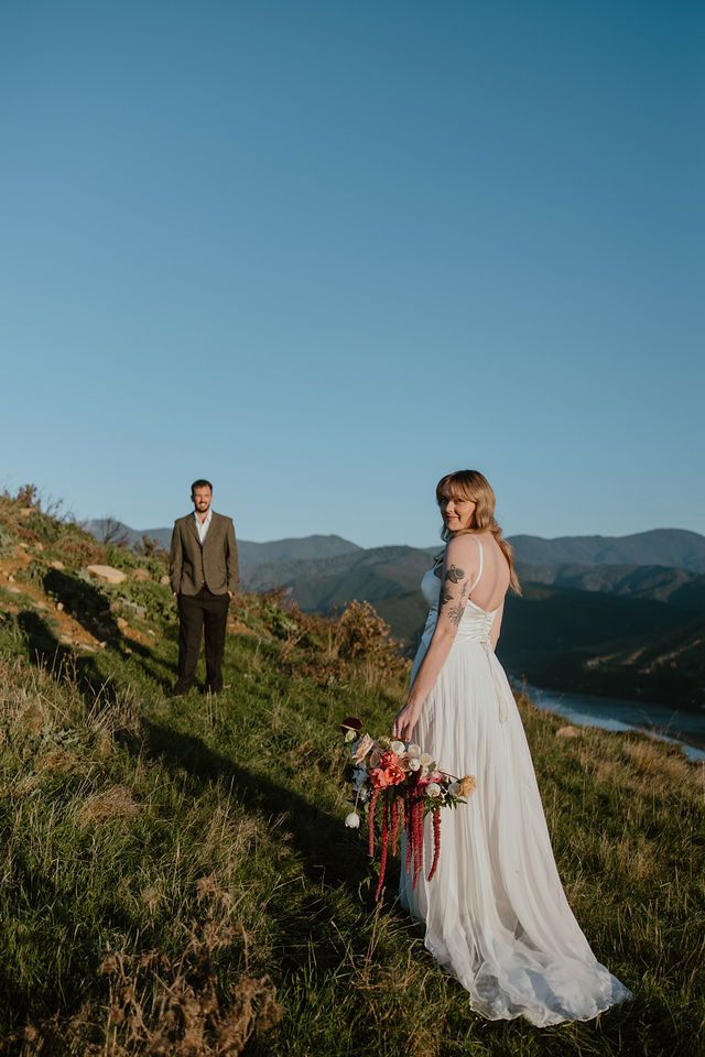 In between moments at sunset elopement in Nelson Tasman. Howdy Pictures, fun laidback wedding photographers on film & digital in New Zealand