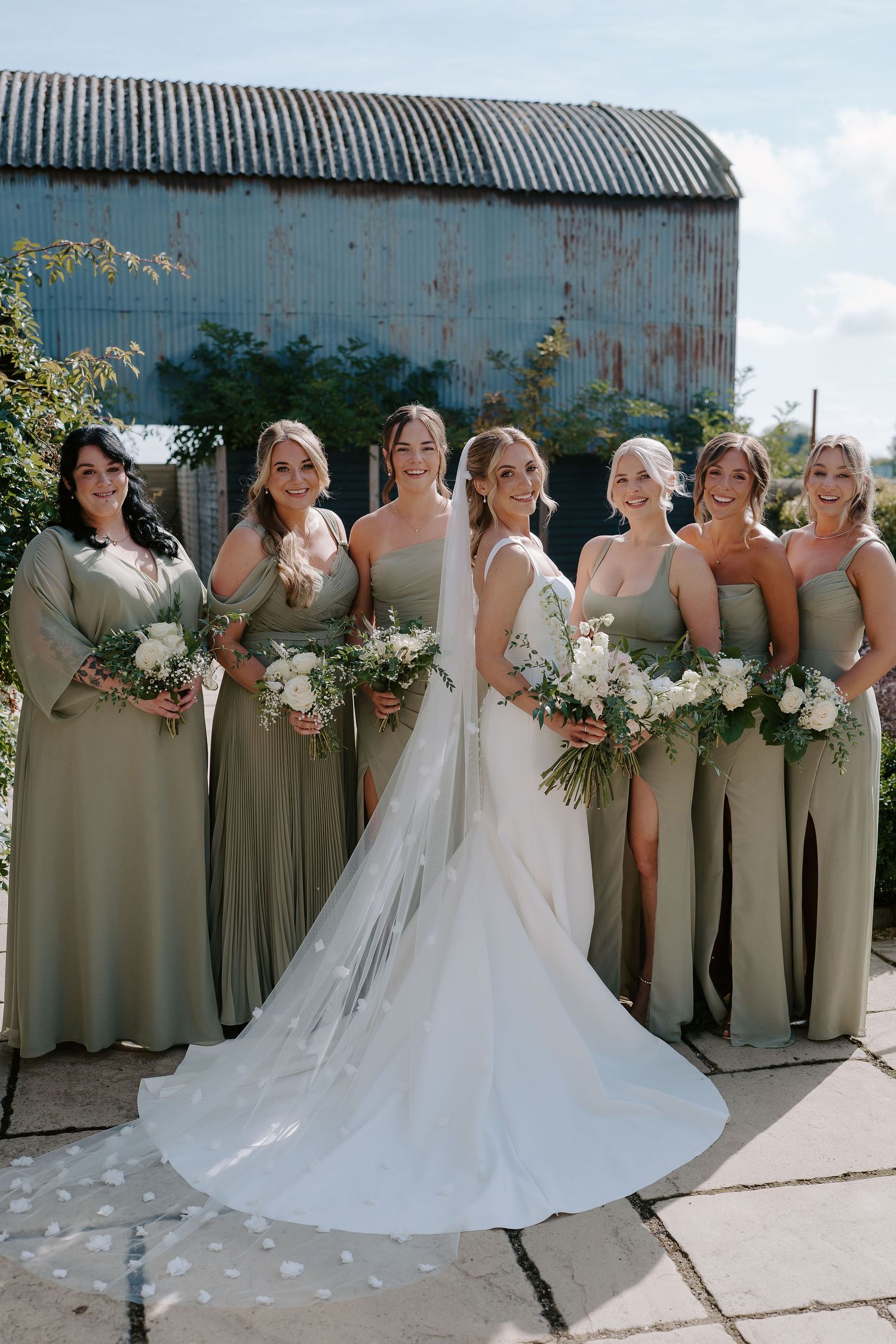 bride and bridesmaids portrait at ivy lodge in cirencester