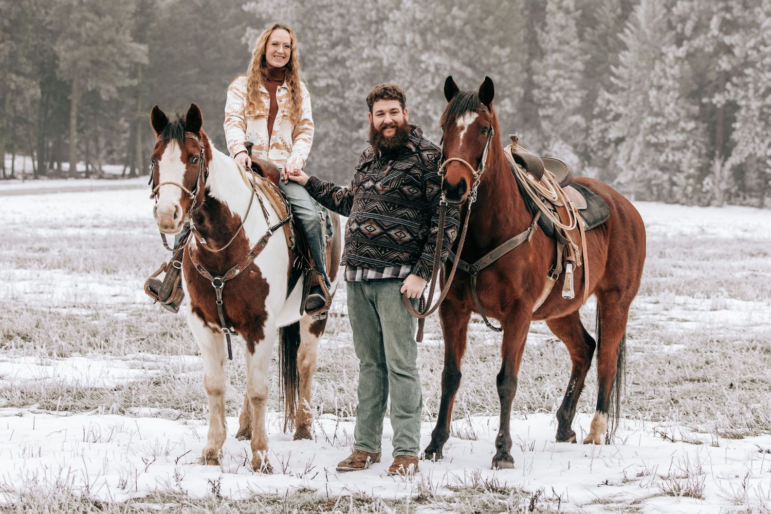 Cle Elum, WA Engagement session couple posing for camera with horses.