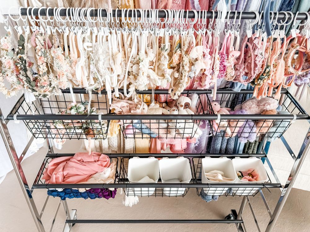 Rows of hanging meat carcasses in a large industrial meat processing facility or butcher shop.