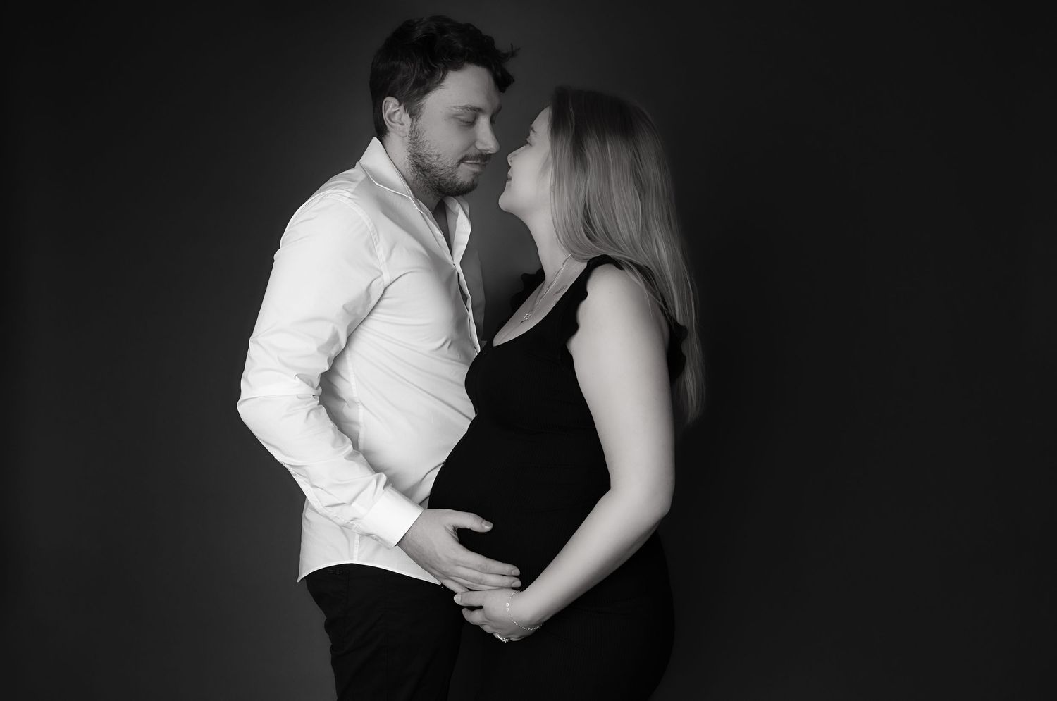 A romantic black and white photo series showing tender moments between a couple.