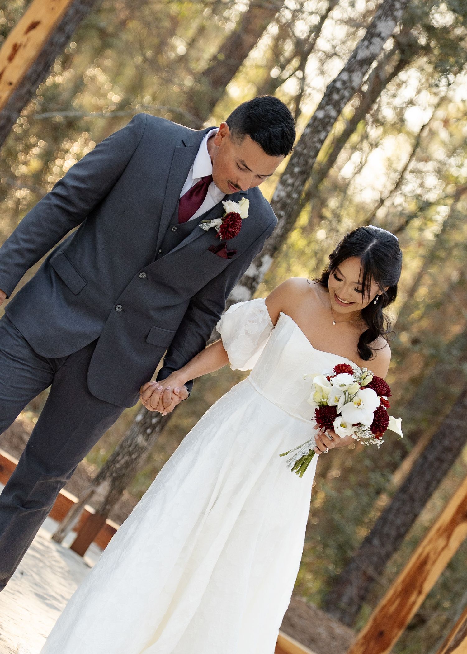Candid moment of couple laughing together in dense Texas woods at their elopement