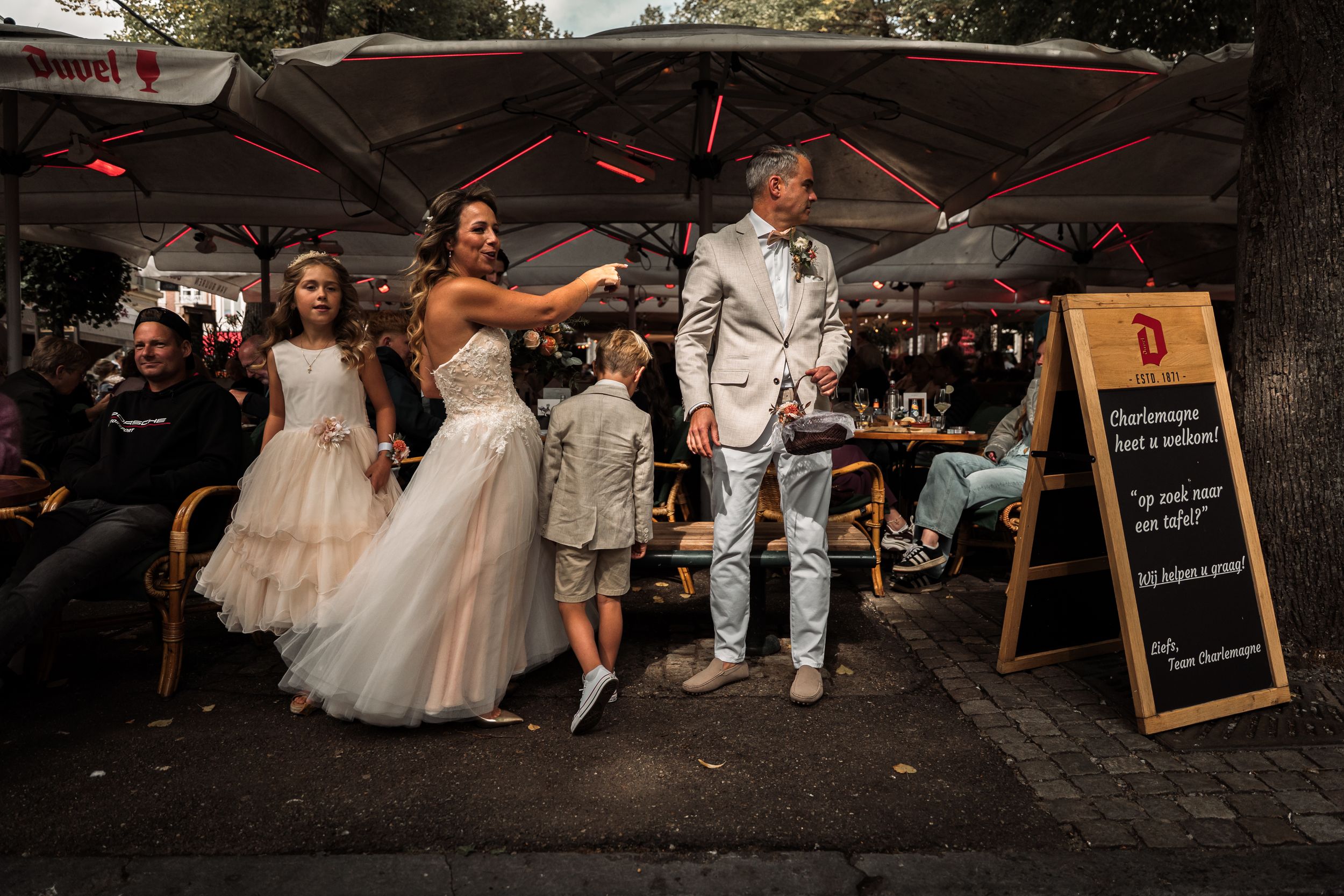 A sequence of candid wedding reception moments captured at an outdoor venue with string lights and rustic decor.