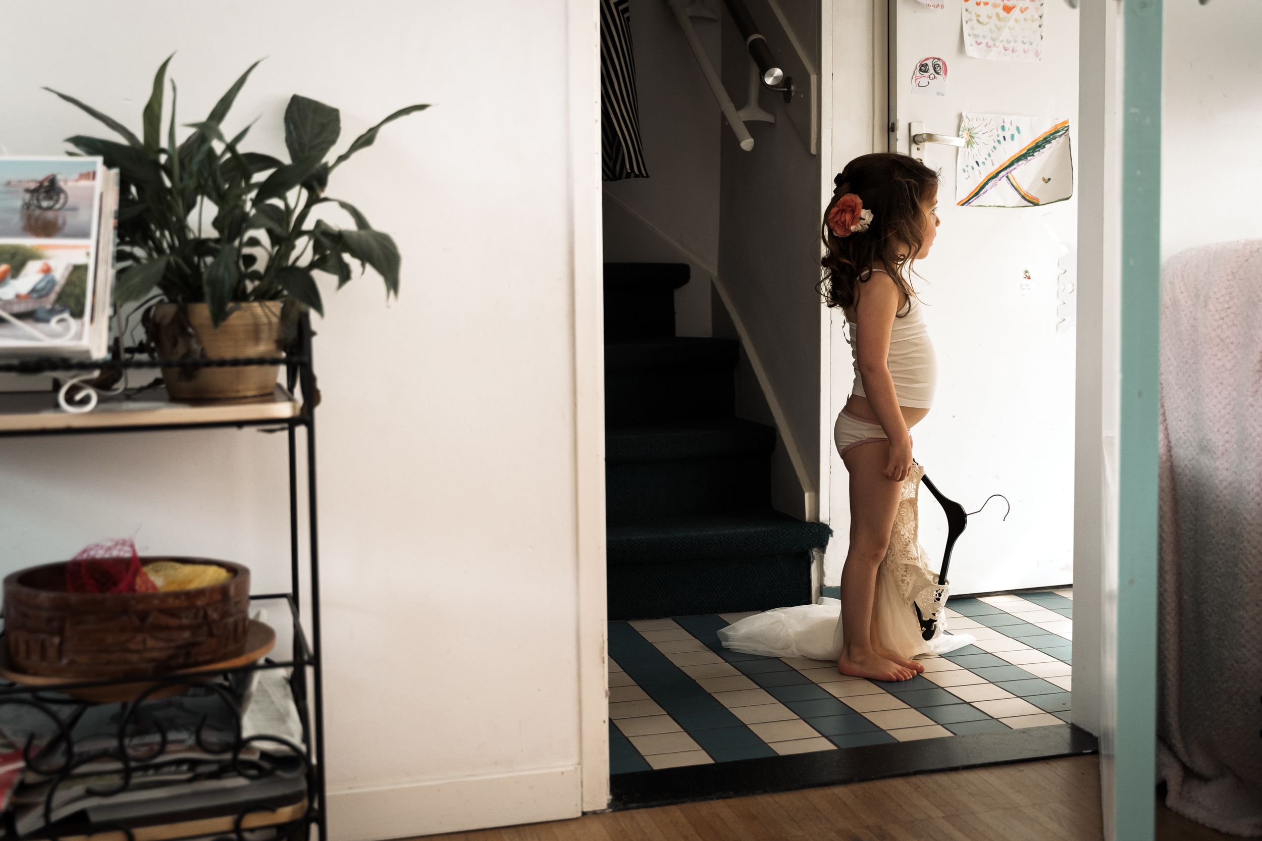 A series of connected interior photos showing a minimalist room with plants, shelves, and natural light.