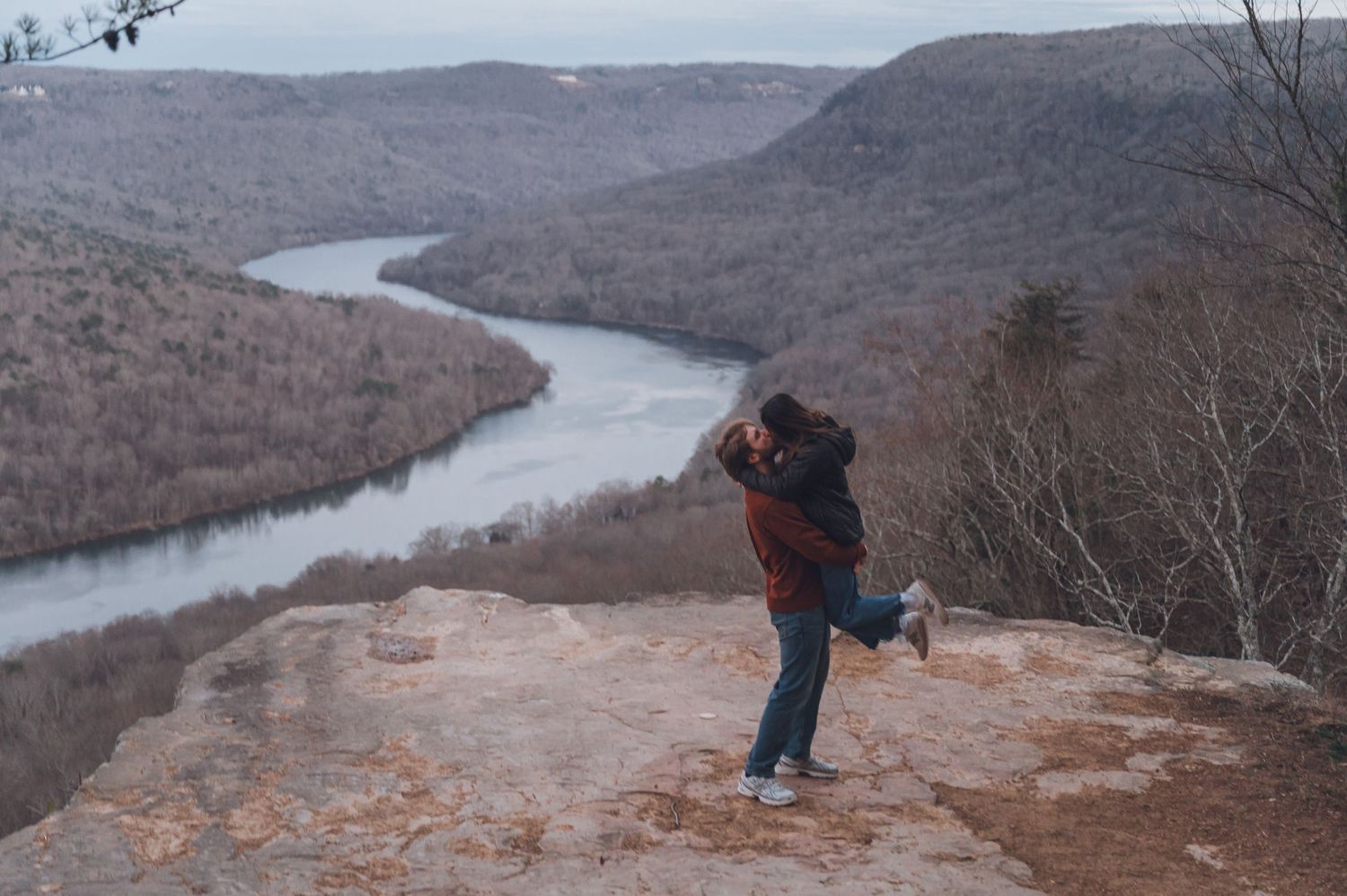A series of scenic overlook photos showing a winding river through a mountainous valley during autumn.