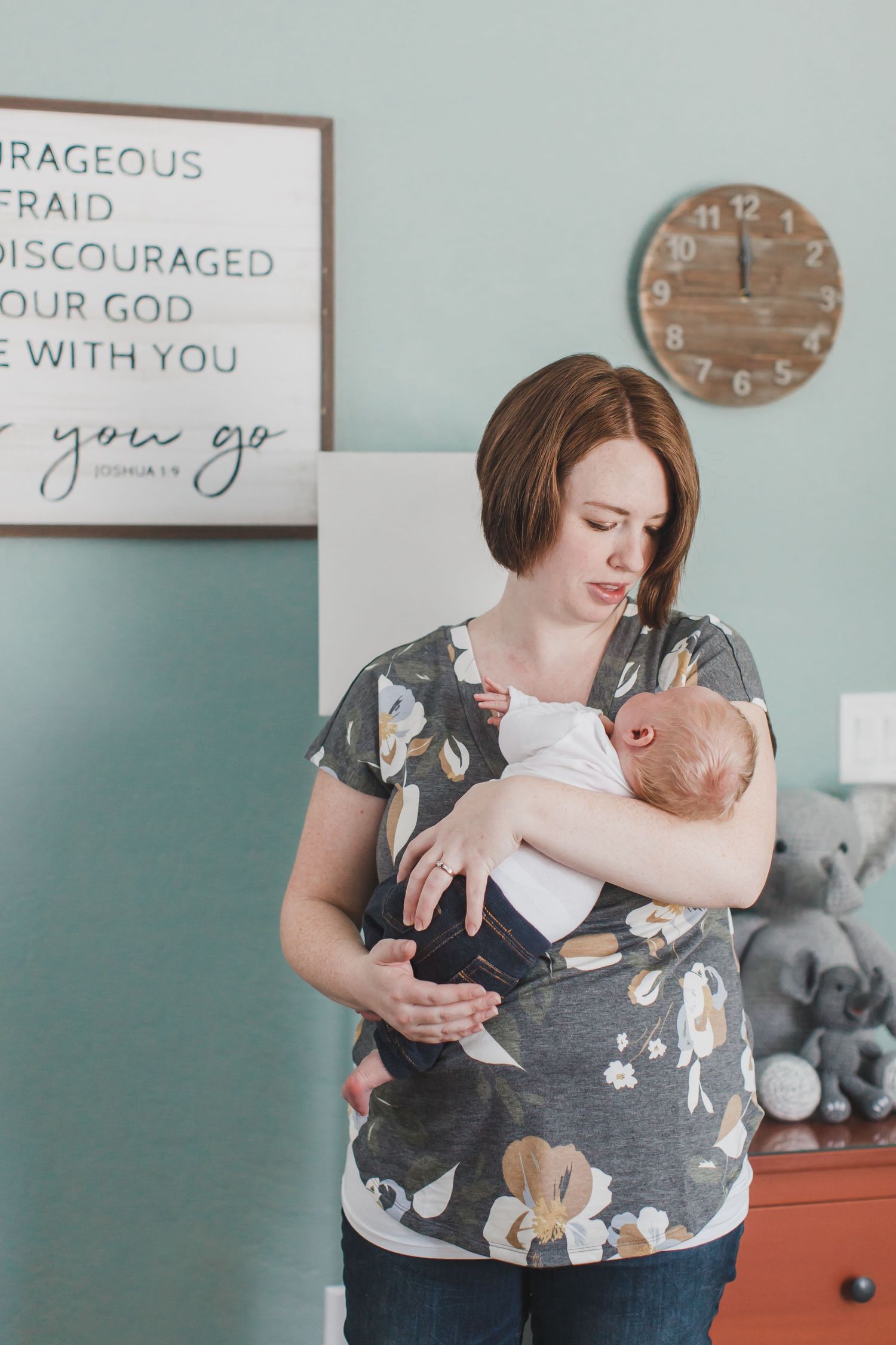 A nursing parent wearing a floral print top holds and comforts a small baby in a series of tender moments.
