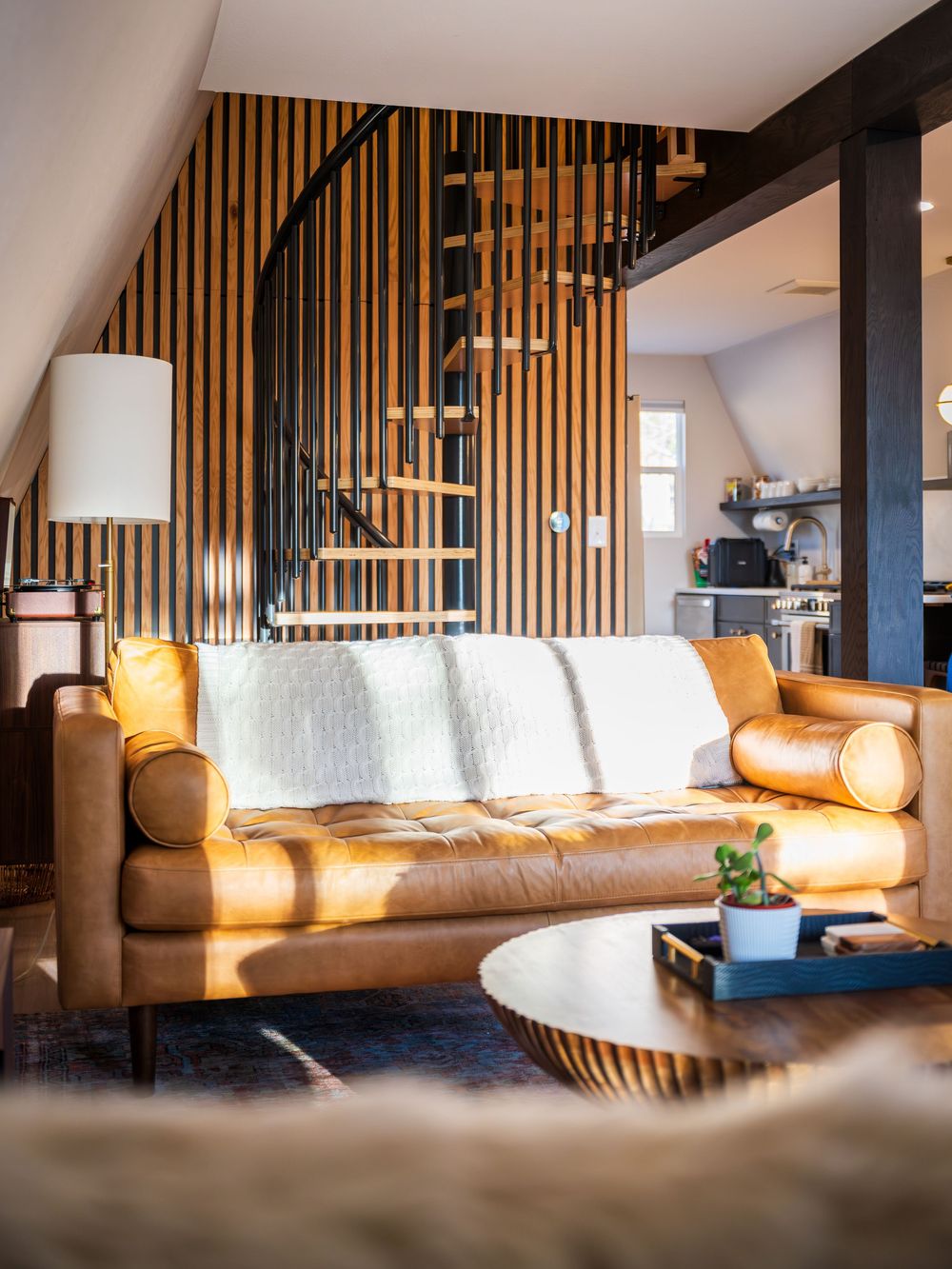 Luxurious living room and spiral staircase by Denver Hospitality, Travel & Tourism photographer Captain Colorado Photography.