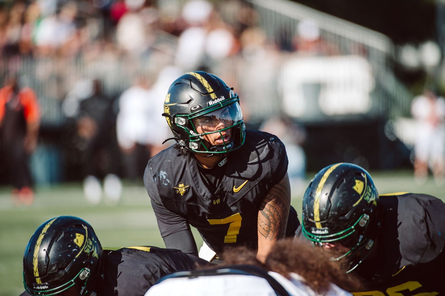 Golden West College quarterback Kauna'oa Kamakawiwo'ole under center with  goal to go.