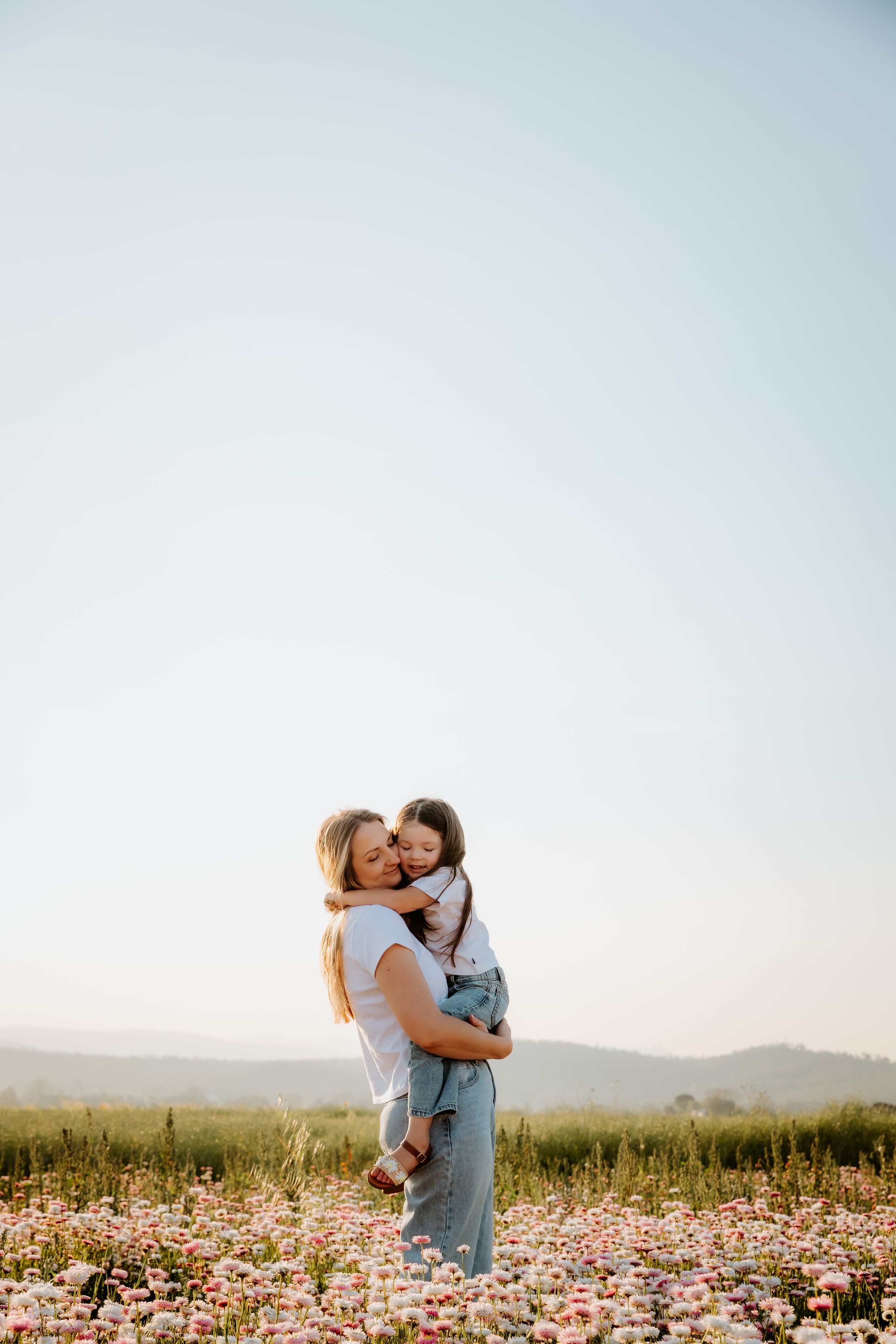 Sweet candid moments of joy and laughter in soft pink tones.