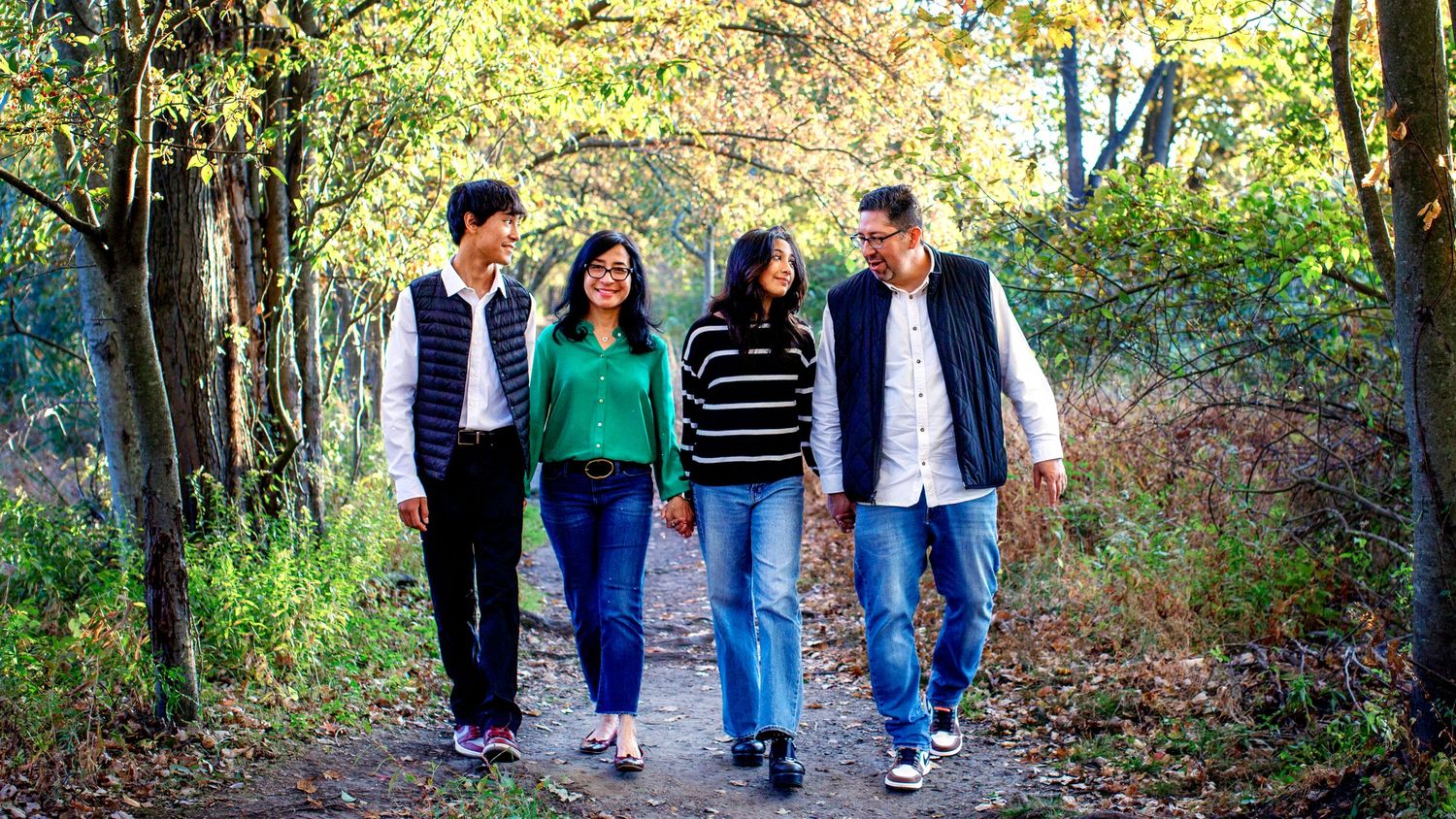 Bergen County family Photographer captures family walking in the woods in Allendale, NJ