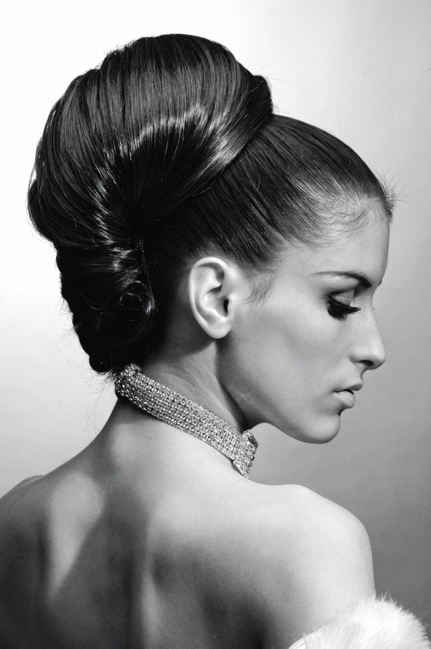 Black and white artistic portrait series showing a graceful profile view adorned with a sparkling choker necklace.