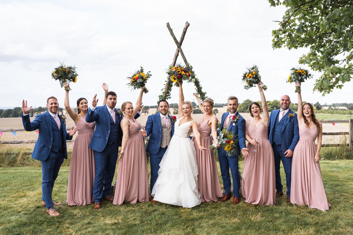 Earth Trust Wedding Photography with the bride, Groom & wedding party posing for photos