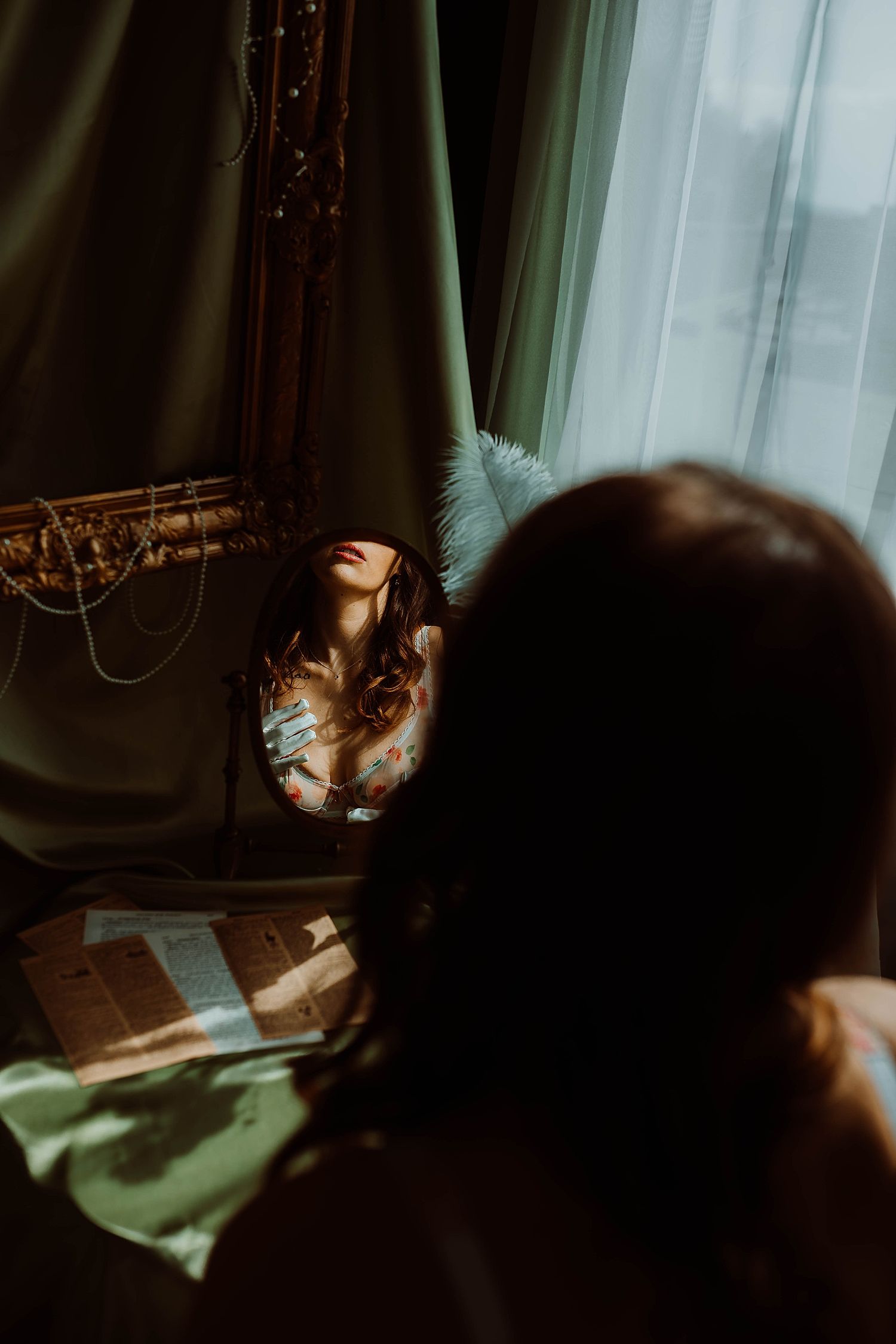 mirror reflects romantic woman look at herself wearing blue regency gloves by Wisconsin boudoir photographer