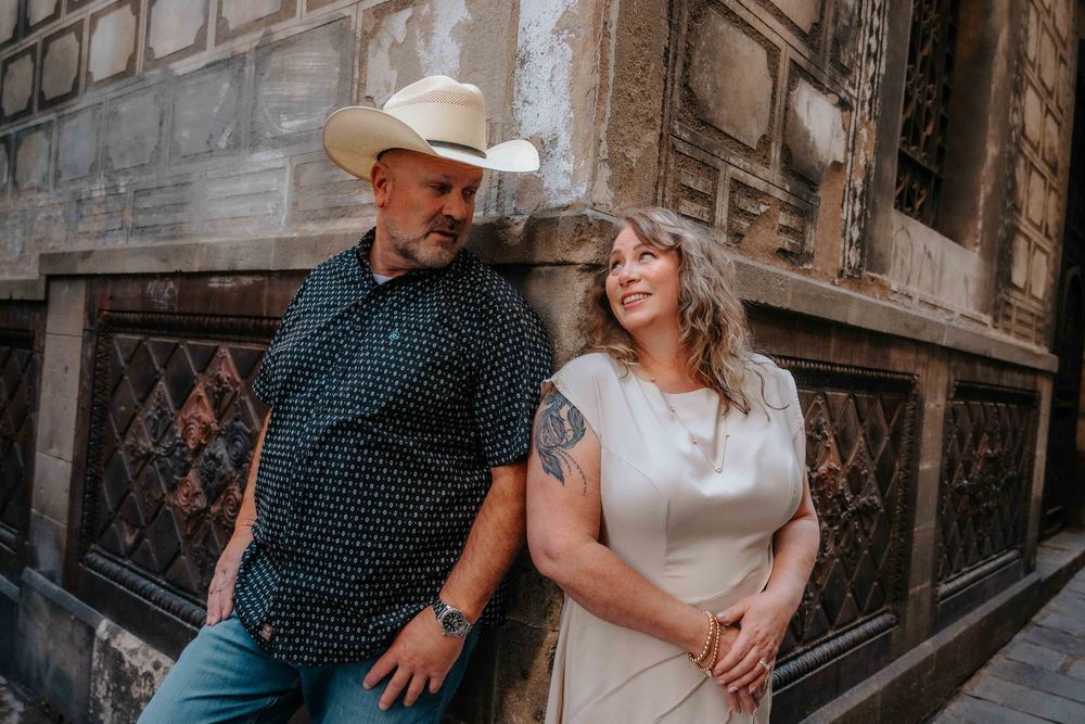 Wide shot of empty Barcelona streets with happy couple.
