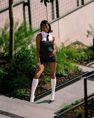 A series of photos showing someone in knee-high white socks and striped dress sitting on outdoor steps.