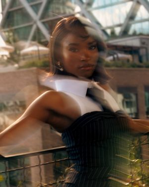 A motion-blurred artistic portrait sequence showing ethereal movement and dynamic poses against a light-filled background.