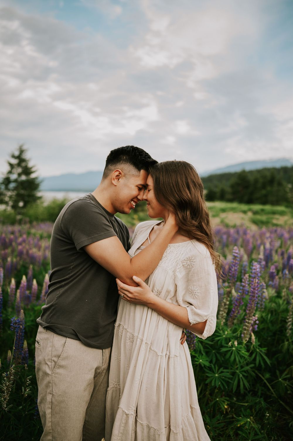 Portrait of couple holding each other lupine field Comox Valley wildflower field locations Photography by Photographer Soulfull Photographs