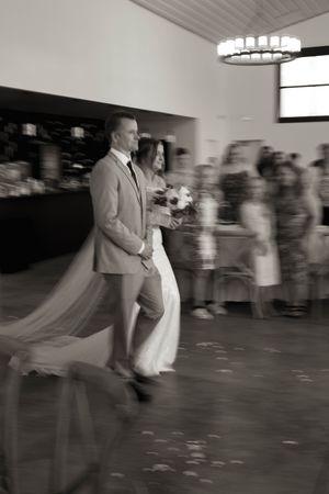 Motion blur captures dancing and movement at a wedding reception.