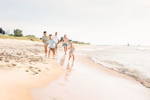running on the sandy shoreline of lake michigan