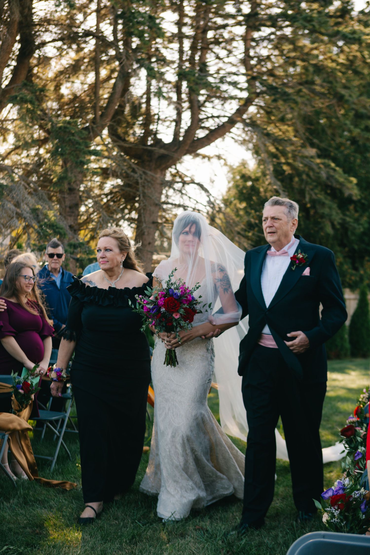 Wedding ceremony sequence showing couple walking down aisle with colorful bouquet.