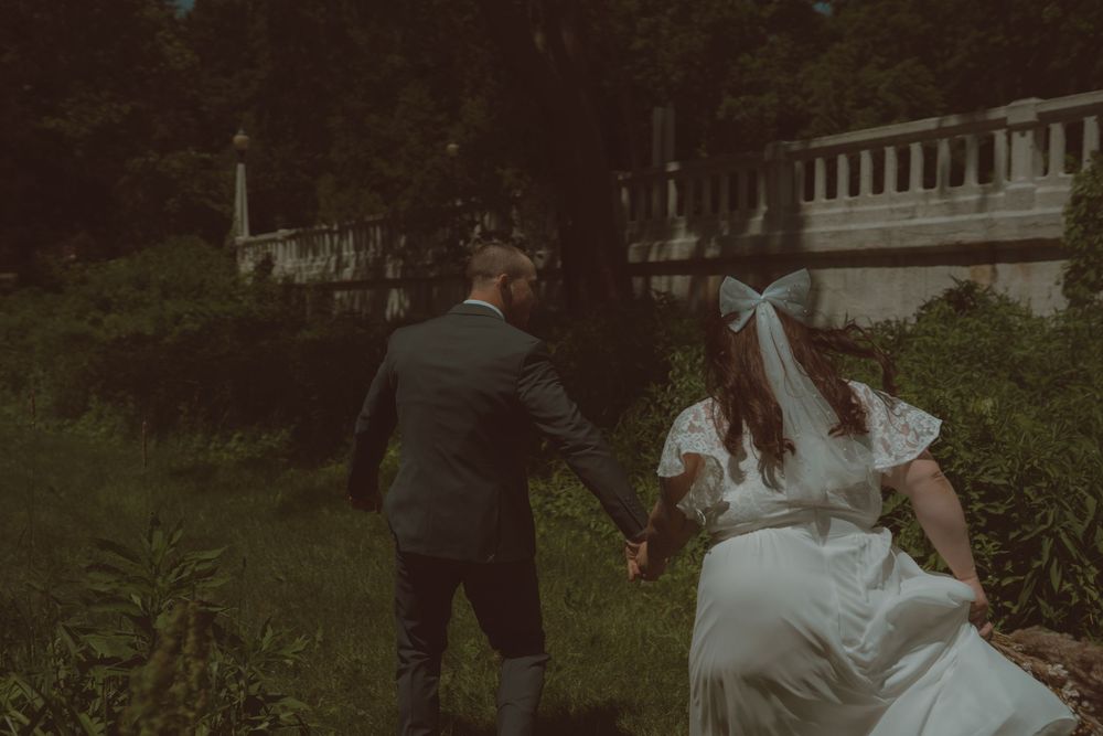Outdoor wedding photography session with natural greenery and soft lighting.