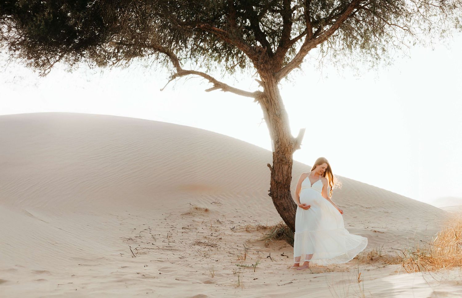 white dress maternity desert photoshoot in abu dhabi
