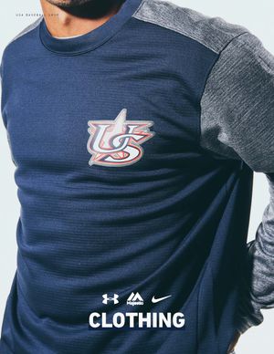 Close-up of navy Under Armour tech fleece pullover with USA Baseball star logo and grey heathered sleeves.