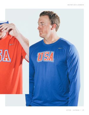 Man wearing Nike USA Baseball royal blue long sleeve Legend Tee with retro block lettering.