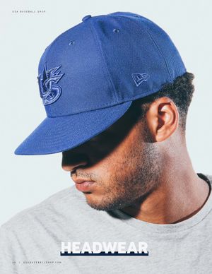Man wearing a royal blue New Era USA Baseball 59FIFTY fitted cap with embroidered logo, shot from below.