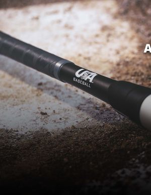 Close-up of a black USA Baseball bat handle with grip tape and branded logo on dirt background.