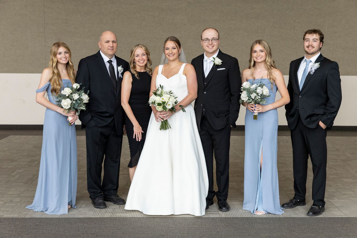 Bride and Groom with family at Alerus Center wedding in Grand Forks, North Dakota