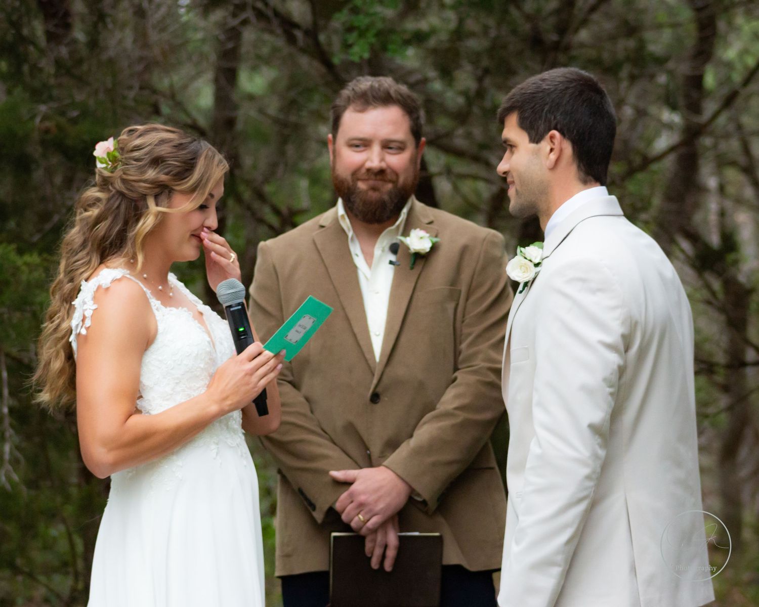 Wedding photo of bride sharing vows to groom